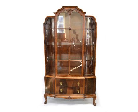 Mid-20th-century walnut display cabinet Mid-20th-century walnut display cabinet, the upper section with sixteen glazed panels