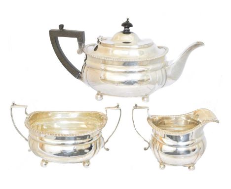 A George V silver three piece tea set, A George V silver three piece tea set, signed Harrods, London SW, Harrods Stores Ltd, 