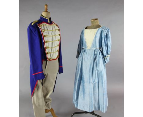 L'Elisir d'Amore: A rail of Royal blue tail coats with red and gold trim, a quantity of peasant blouses and skirts, dresses a