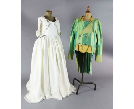 Don Giovanni: A rail with a mint green tail coat and yellow waistcoat and tights, a purple gold braided frock coat, a hooded 