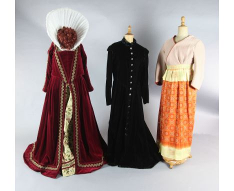 Don Carlos; Maria Stuarda and Il Trovatore: A rail with a maroon velvet two piece ruff and red wig for Elizabeth I and a larg