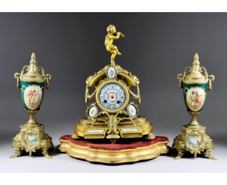 A Late 19th Century French Gilt Metal and Porcelain Mounted Mantel Clock and a Pair of Similar Urn Pattern Ornaments, the clo