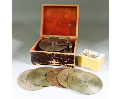 A Small Paper Covered Pine Cased Polyphon, Late 19th Century, to take 4.5ins diameter discs, with 1.75ins steel comb, in squa