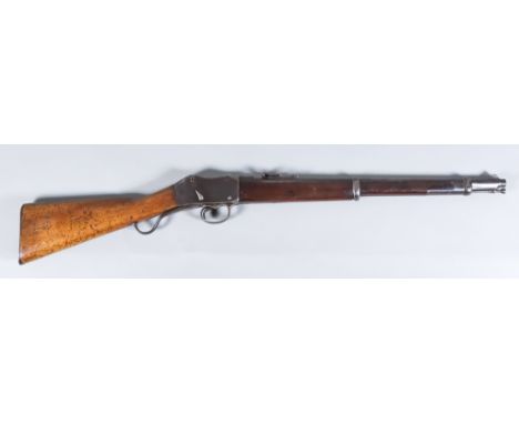 An 1895 .46 Calibre Martini Action Enfield Rifle, 21ins blued steel barrel with elevating sights, barrel marked with numerous