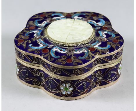 A Chinese Enamel Box and Cover of Lobed Outline, decorated with bats and with a central carved and pierced hardstone tablet, 