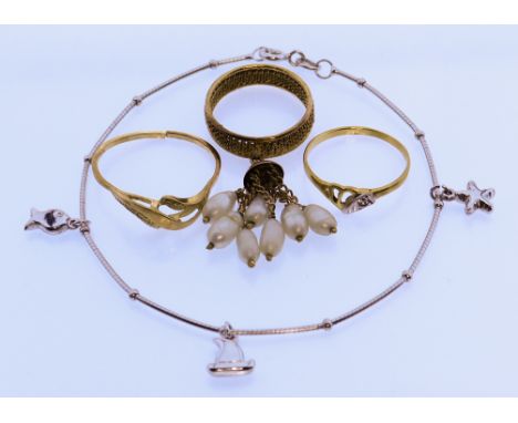 A Mixed Lot of 18ct Gold, Modern, comprising - a white gold child's bracelet with three suspended charms, 180mm, two small 18