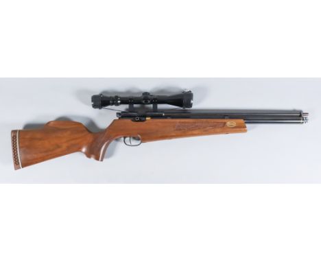 A .22 Calibre Pre-Charged Air Rifle by Falcon, Serial No. 81282, the 21ins blued steel barrel, blued steel action, hardwood s