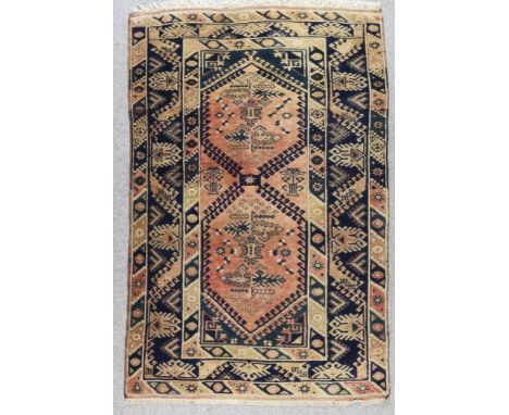 A Turkish Runner of "Kazak" Design, 20th Century, woven in pastel shades, with five lozenge shape medallions on an ivory grou