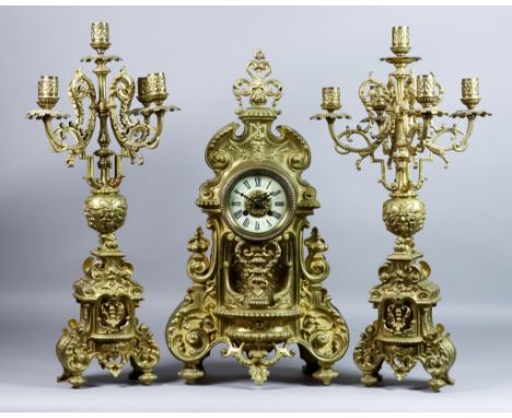 A Late 19th/Early 20th Century French Brass Cased Three-Piece Clock Garniture, the clock by Japy Freres, No. 779 72, the 3.5i