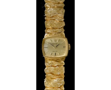 A Lady's Rolex Wristwatch, 20th Century, 9ct Gold Cased, with integral bracelet, the rectangular gold dial with gold baton nu