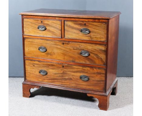 A Late Georgian Mahogany Chest, with moulded edge to top, fitted two short and two long drawers with folding loop handles wit