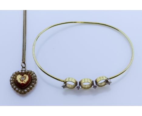 A 14ct Gold and Diamond Stiff Bangle, set with four small brilliant cut diamonds, approximately 170mm circumference, and a 14