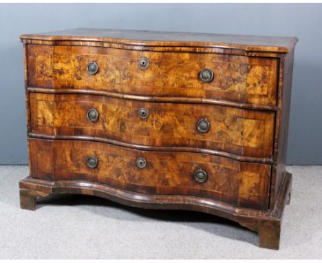 An 18th Century North Italian Figured Walnut Serpentine Fronted Commode, the figured quarter veneered top inlaid with banding