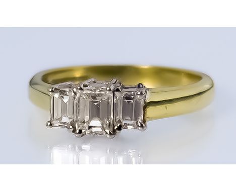 A Three Stone Diamond Ring, Modern, in 18ct gold mount, set with three baguette cut diamonds, approximate total diamond weigh