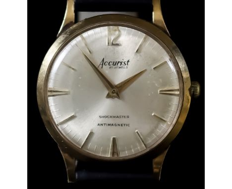 An Accurist Wristwatch, 20th Century, 9ct Gold Cased, the cream dial with gold baton numerals, 32 diameter, manual wind, on n