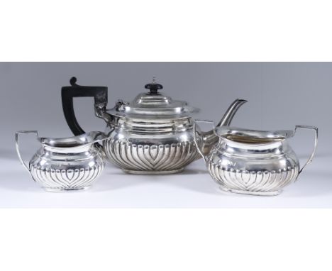A Late Victorian Bachelors Silver Oval Three-Piece Tea Service, by Charles Boyton, London 1895, with part reeded bodies and a