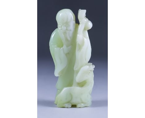 A Chinese Celadon Jade Figure of Shoulao and a Deer, 20th Century, 7.25ins (18.4cm) high