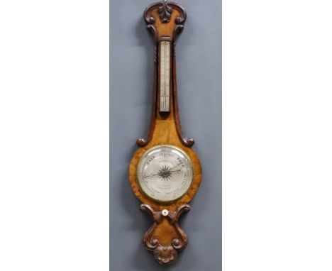 A Victorian Walnut Cased Wheel Barometer and Thermometer by Hy. Robinson, 15 High Street, Shrewsbury, with 8ins diameter silv