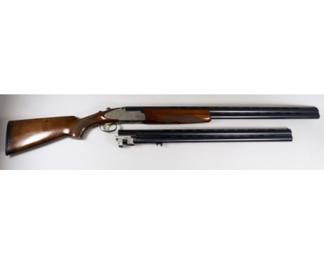 A 12 Bore Over and Under Shotgun, by Rizzini, Serial Nos. 63046/47, with two sets of  29.5ins and 26ins blued steel barrels w