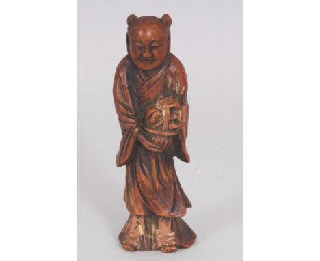 A JAPANESE MEIJI PERIOD BAMBOO NETSUKE OF THE CHINESE IMMORTAL LAN CAIHE, bearing a basket of flowers, 3.6in high.
