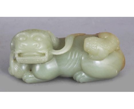 A CHINESE CELADON JADE MODEL OF A BUDDHISTIC LION & ITS PUP, 3.6in long & 1.75in high.