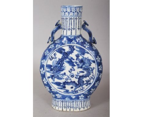 A CHINESE BLUE & WHITE PORCELAIN DRAGON & PHOENIX MOON FLASK, the base with a four-character Kangxi mark, 8in high.