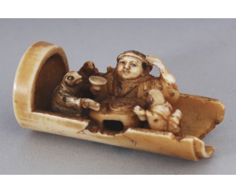 A GOOD QUALITY SIGNED JAPANESE MEIJI PERIOD IVORY NETSUKE OF DAIKOKU, seated within an open half-cylinder and eating in the c