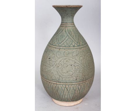 A CHINESE SONG/YUAN STYLE CELADON CERAMIC BOTTLE VASE, the base unglazed, 9.7in high.