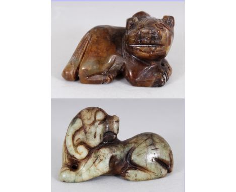 AN ARCHAIC STYLE JADE CARVING OF A BUDDHISTIC LION, 2.7in wide & 1.5in high; together with another jade carving of a ram, 2.6
