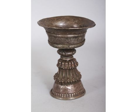 A 19TH CENTURY TIBETAN SILVER-METAL YAK BUTTER LAMP, the sides of the bowl with scroll work engraving, 2.9in diameter & 4in h