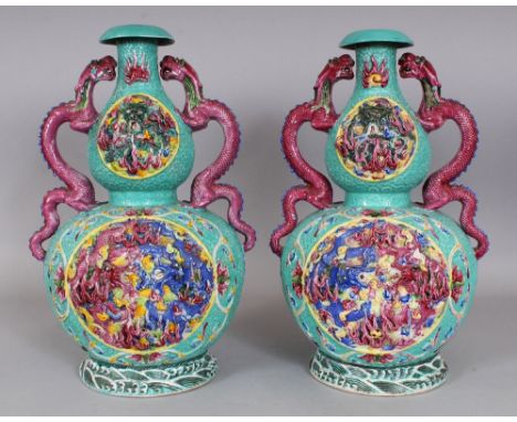 A LARGE PAIR OF 19TH/20TH CENTURY CHINESE FAMILLE ROSE MOULDED DOUBLE GOURD PORCELAIN VASES, each decorated with raised relie