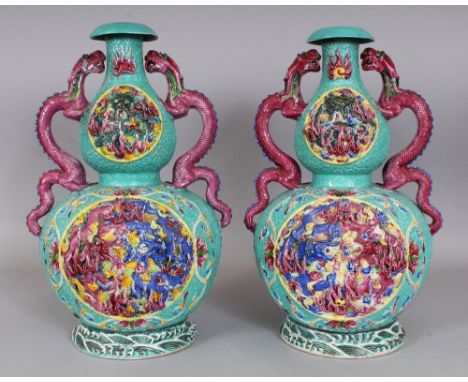 A LARGE PAIR OF 19TH/20TH CENTURY CHINESE FAMILLE ROSE MOULDED DOUBLE GOURD PORCELAIN VASES, each decorated with raised relie