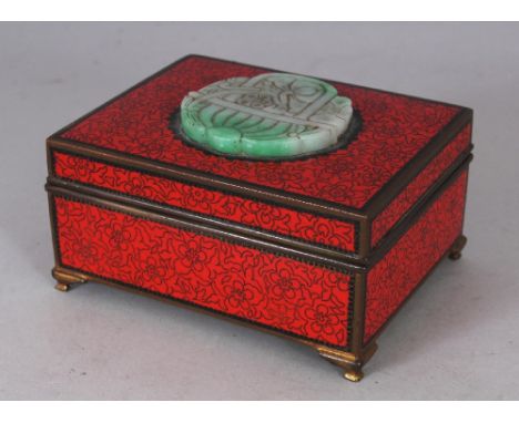 AN UNUSUAL EARLY 20TH CENTURY CHINESE & JAPANESE JADE & CLOISONNE RED GROUND RECTANGULAR BOX, the cover inset with a shaped a