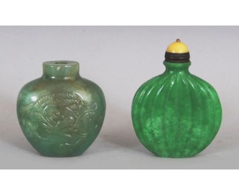 TWO CHINESE GREEN JADE SNUFF BOTTLES, one with a stopper, one carved with a dragon to each side, the other ribbed, 2in & 2.6i