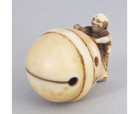 A JAPANESE MEIJI PERIOD IVORY NETSUKE, carved in the form of a man attempting to push a giant temple bell, 1.3in long & 1in h