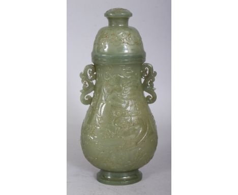 A GOOD 19TH/20TH CENTURY CHINESE CELADON JADE-LIKE HARDSTONE DRAGON VASE & COVER, of archaic form, each side decorated in rel