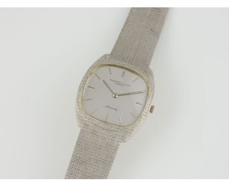 ARMBANDUHR 'AUDEMARS PIGUET TONNEAU'Schweiz, 20. Jh.Referenznummer: 5279BC. Automatik. Weißgold, gest. 750. L. 18,3 cm, B. 3,