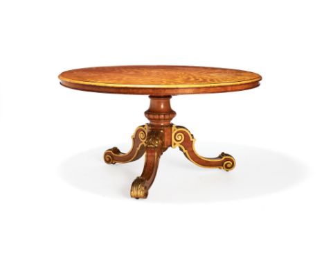 A fine Victorian parcel-gilt satinwood centre table, attributed to Holland & Sons, circa 1860, with figured circular tilt-top