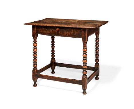 A William & Mary oak side table, late 17th century, the rectangular top with moulded edge, above a frieze drawer, on bobbin t