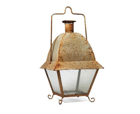 A white painted wrought and sheet iron and glazed hanging storm lantern, early 20th century, the tapered square section frame