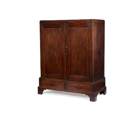 A George II mahogany linen press, circa 1750, in the manner of Thomas Chippendale, the panel doors enclosing an arrangement o