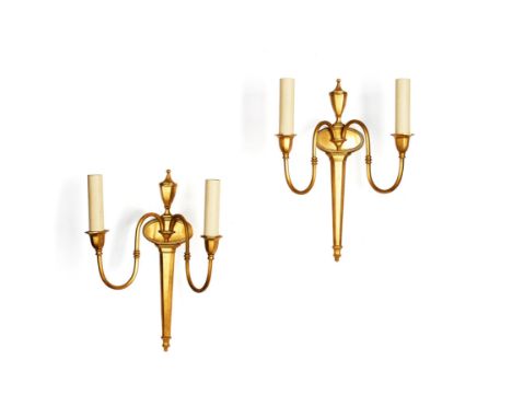 A pair of gilt metal twin light wall appliques in Adam taste, later 20th century, each with urn finial and scroll branches, 4