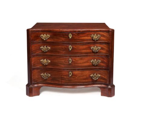 A George III mahogany serpentine chest of drawers, circa 1760, the shaped caddy top with moulded edge, above four long gradua