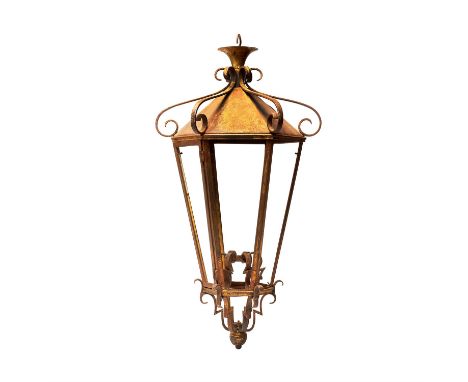 A French metal hexagonal hanging lantern, 20th century, with open scrollwork design overall, traces of gilding, 84cm high, 45