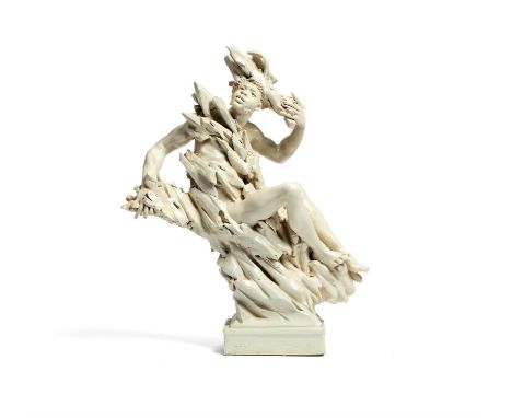 Spadini; a white glazed ceramic figure , circa 1950, seated on a naturalistic base, 36cm highCondition Report: chips between 