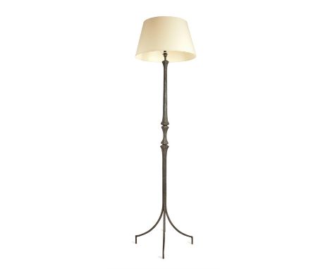 A wrought iron standard lamp, mid-20th century, in the manner of designs by Diego Giacometti, the textured square section ste