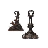 A Victorian cast iron door stop in Rococo Revival taste
