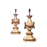 A pair of silvered and cream painted wood urn table lamps