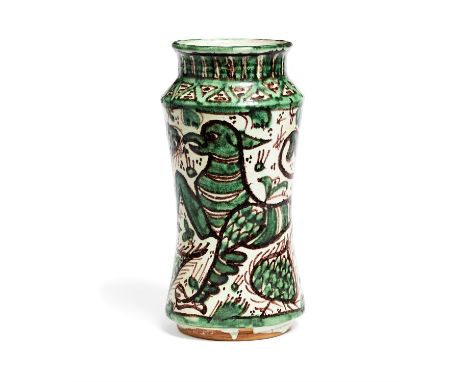 A late 19th century albarello, Spanish, decorated with a large griffon surrounded by flowers and other foliate motifs, 15.5 c