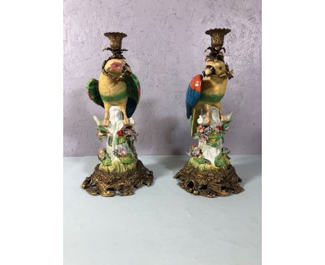 Pair of ceramic parrot candle holders with metal mounts in an early 18th Century style each approximately 38cm high
